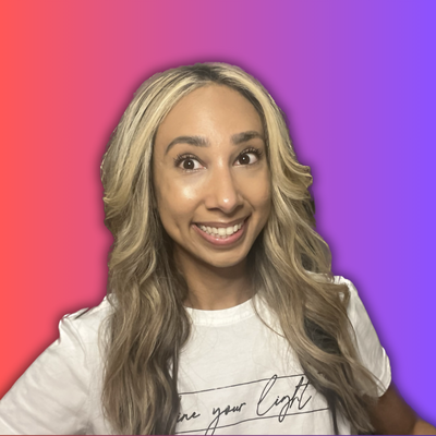Jennifer Mahal smiling at the camera against a red and purple background